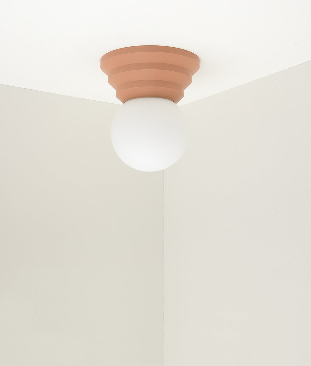 Applique "Colonnade", base pyramide, verrerie boule mate, vieux rose