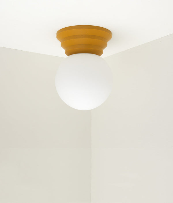 Applique "Colonnade", base pyramide, verrerie boule mate, grand modèle, jaune safran