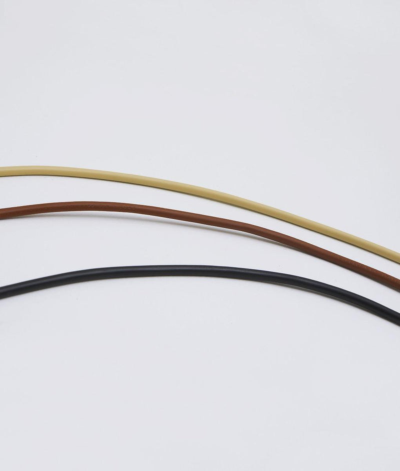 Gamme des câbles disponibles pour les suspensions "Grège" : crème, marron et noir